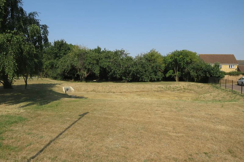 Grassed soakaway area serving new houses in England